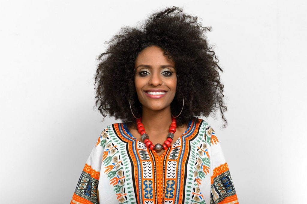 Woman with voluminous curly hair in transition