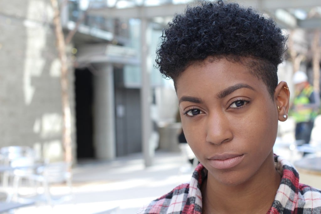 Woman with curly hair, short