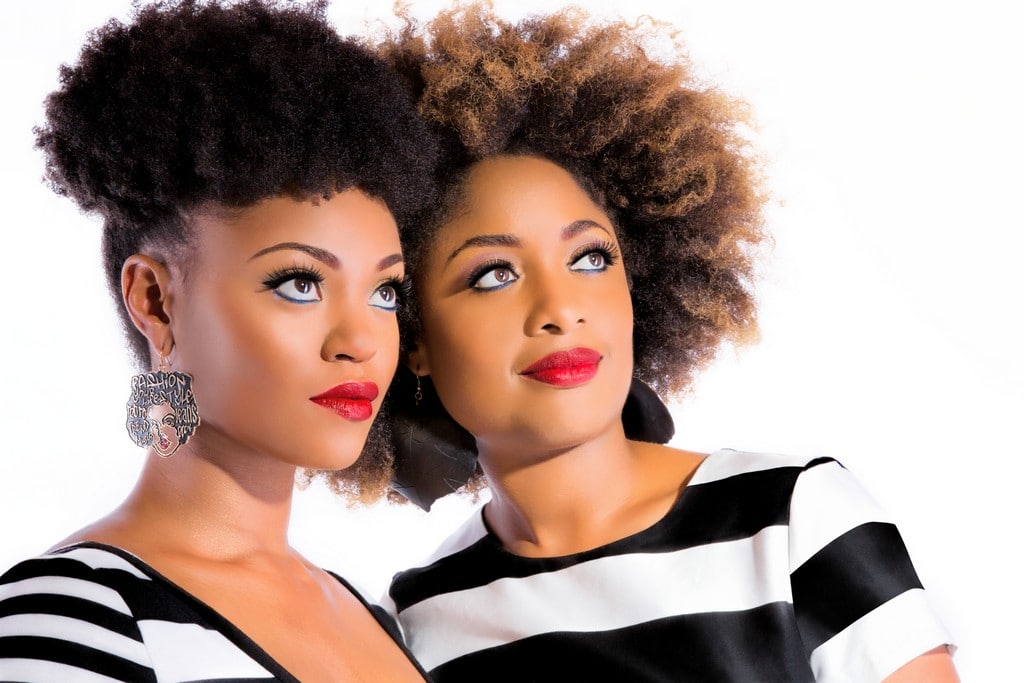 Two women with curly hair in transition 