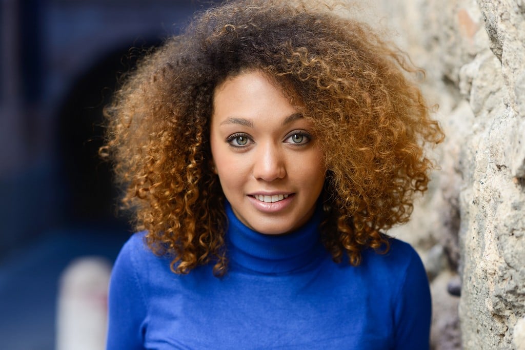 Woman with curly hair, short