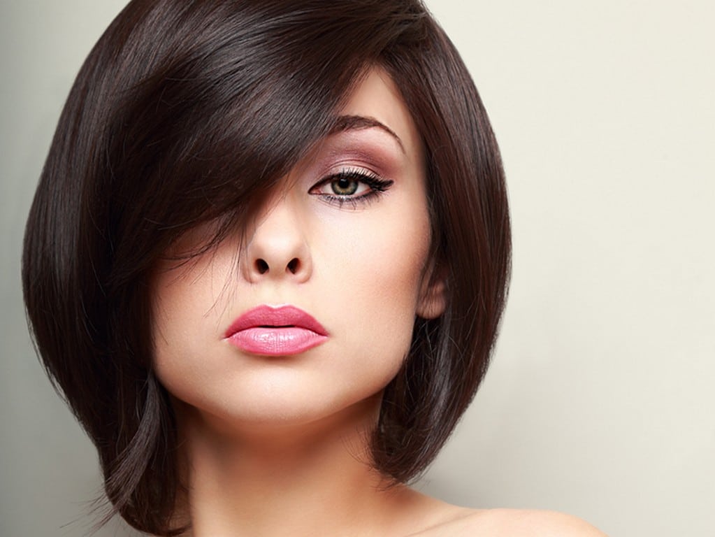 Woman with straight hair, short, long fringe with lots of shine