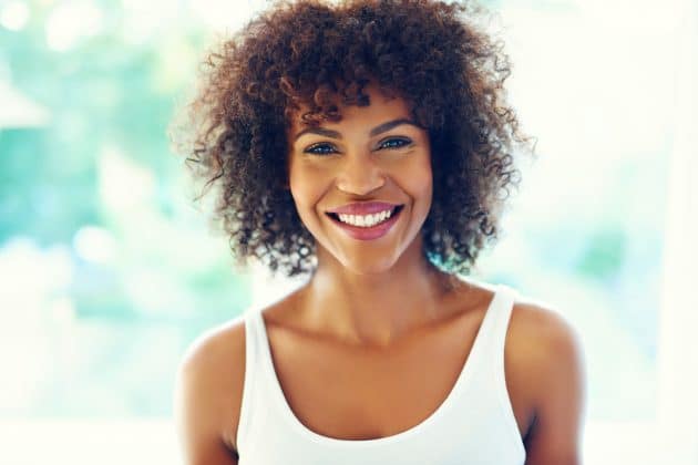 Woman with curly hair with medium fringe