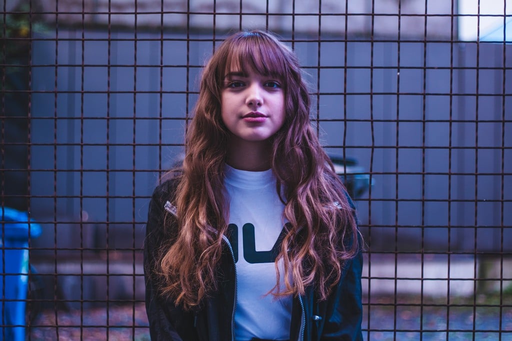 Woman with straight hair, half moon fringe