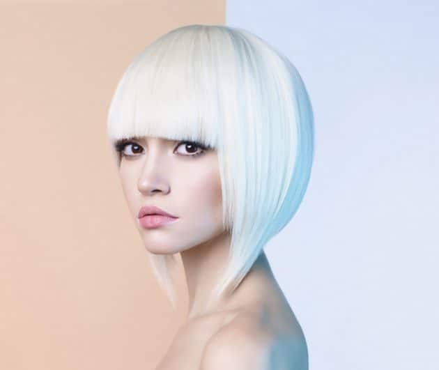 woman with short platinum hair with bangs