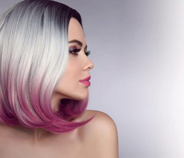 Straight hair model with almost white highlights and pink hair tips