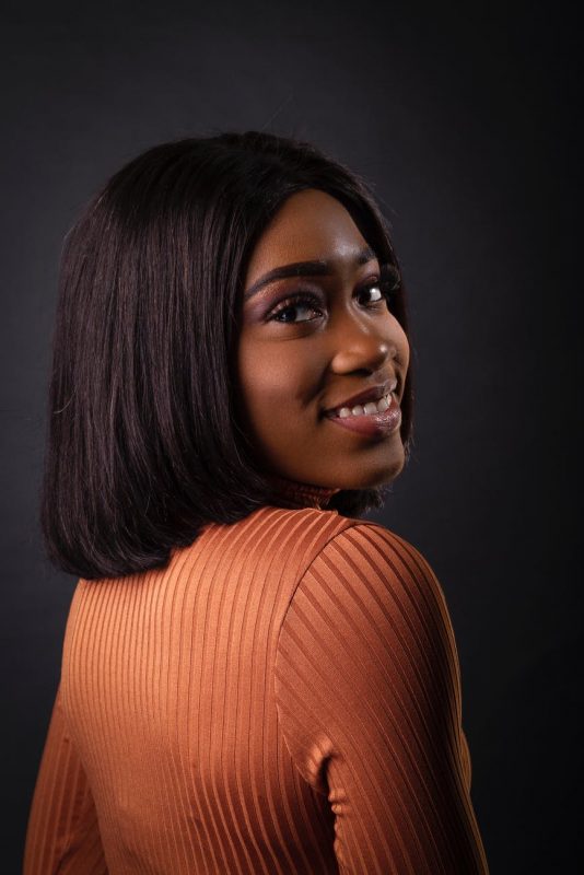 Young model poses for photo to show her straight curly hair straightened